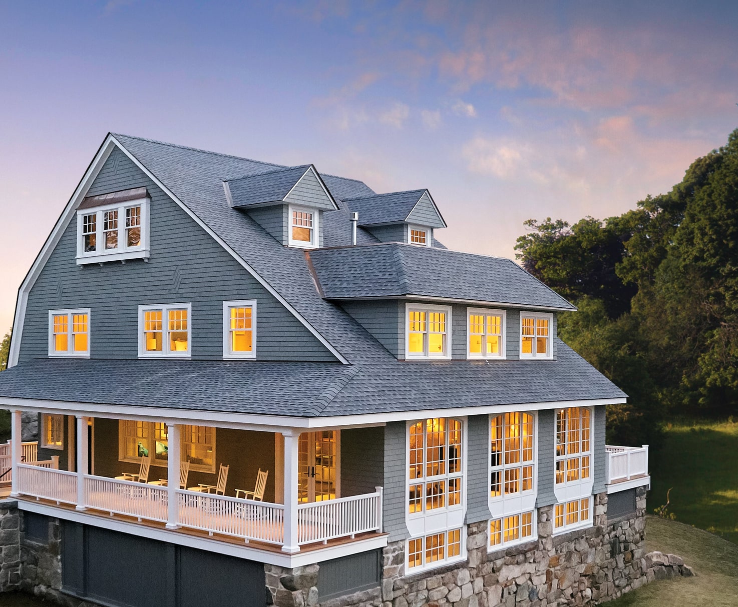 Exterior view of home with gray siding and gray shingles